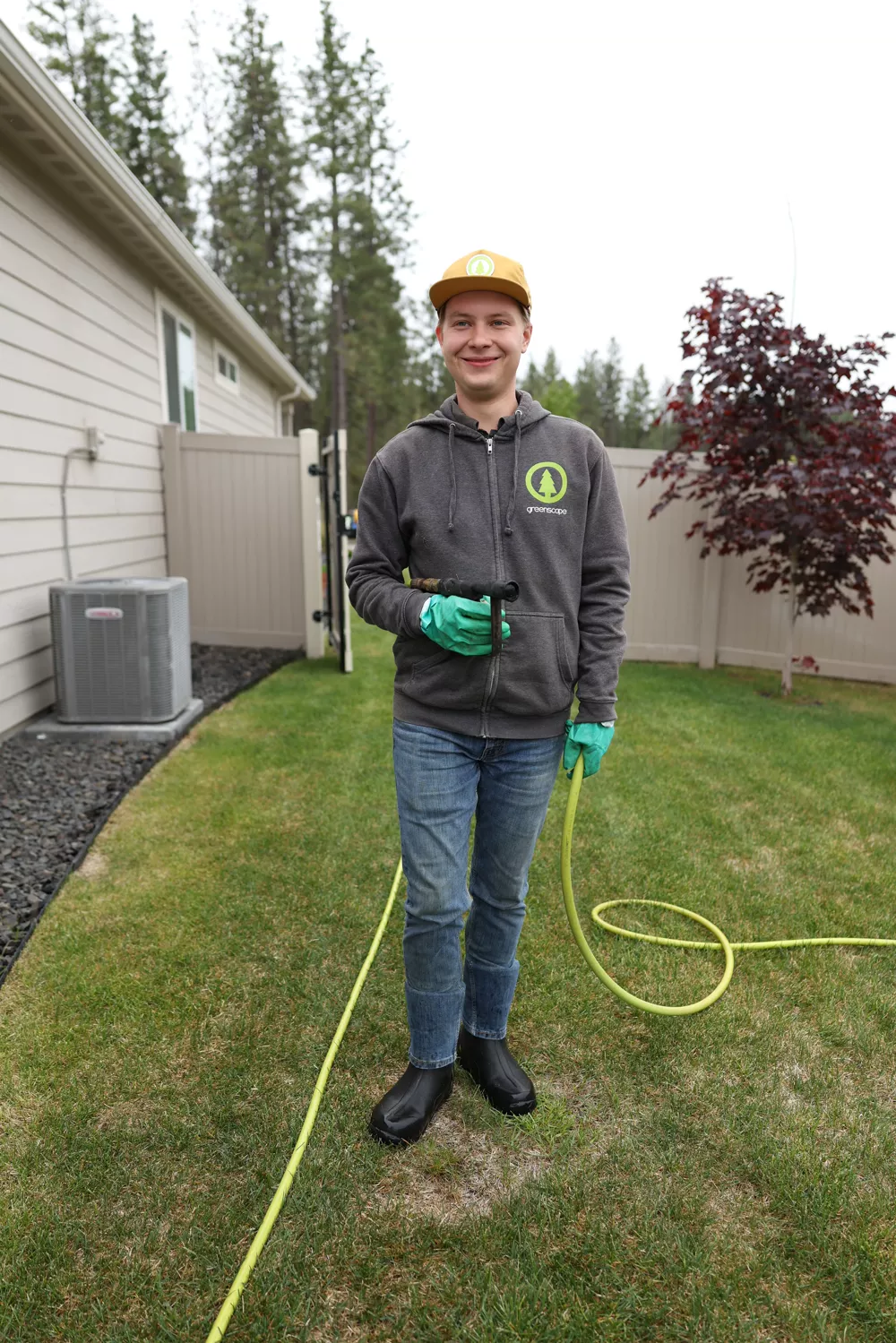 Greenscape lawn care technician on a Spokane lawn