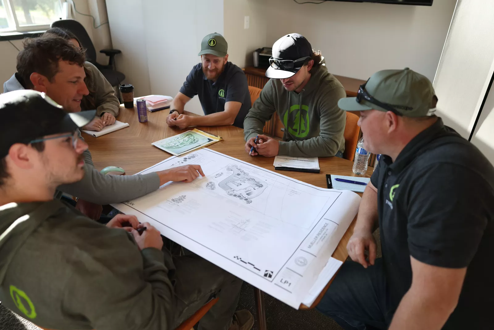 Greenscape team reviewing a landscape plan together