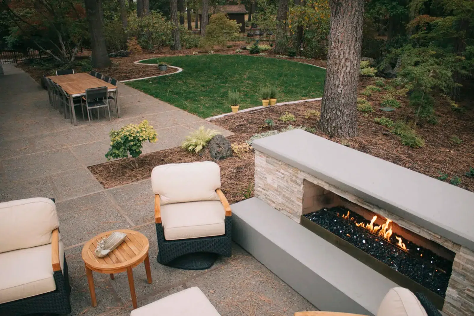 landscape design fire place seating area and greenspace
